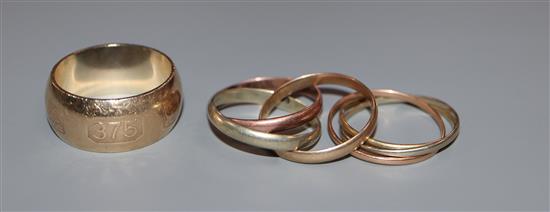 A Russian 9ct three colour gold wedding ring, one other unmarked Russian ring and a modern 9ct gold wedding band.